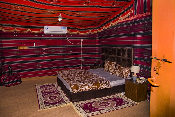 Experience the charm of a Bedouin camp with a cozy interior perfect for indulging in a BBQ dinner under starlit skies and savoring traditional Arabic breakfast at sunrise.